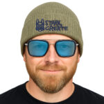 Olive green rib-knit beanie with cuffed edge, embroidered with Stark Create logo and branding